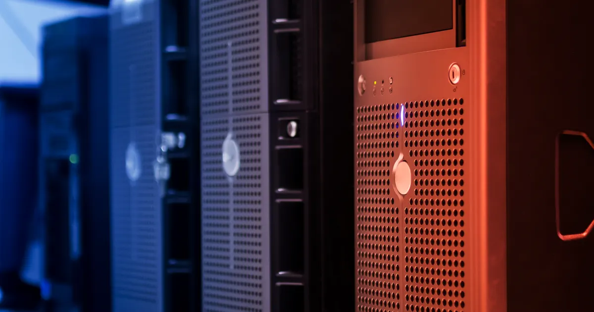 Close-up of tower servers in a data center with blue and red lighting, illustrating the SEO definition of Canonical tag